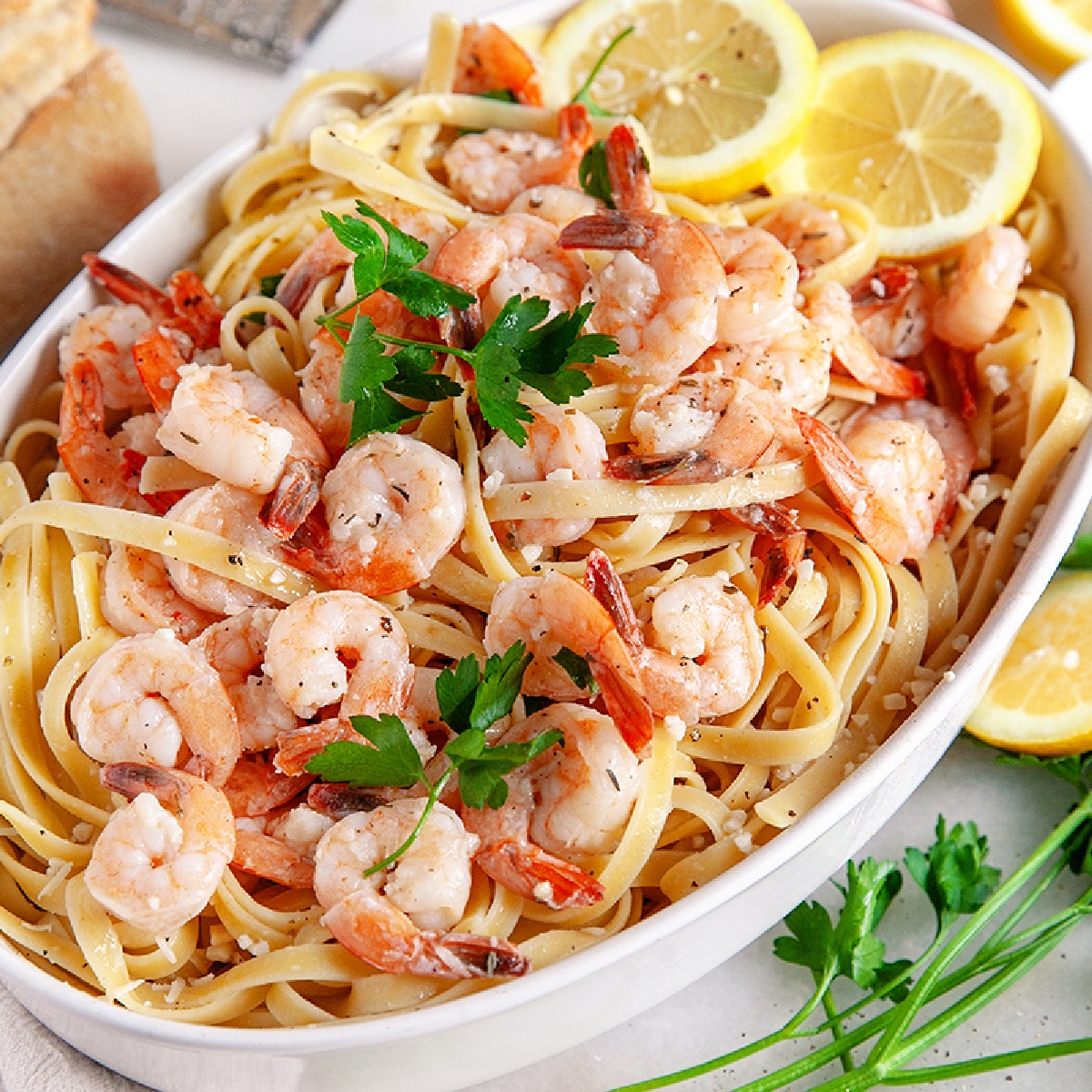Square photo of a casserole dish filled with Shrimp Pasta. 