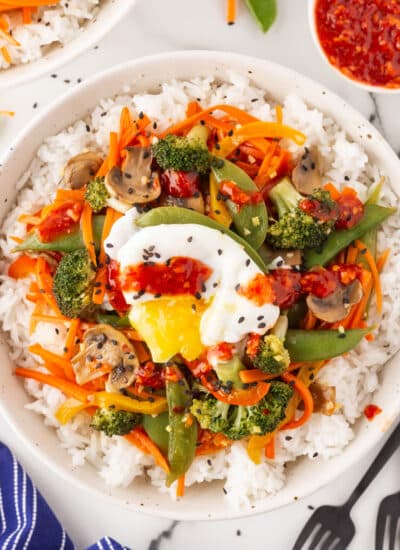 Overhead shot of a poached egg on a Vegetarian Stir-Fry.