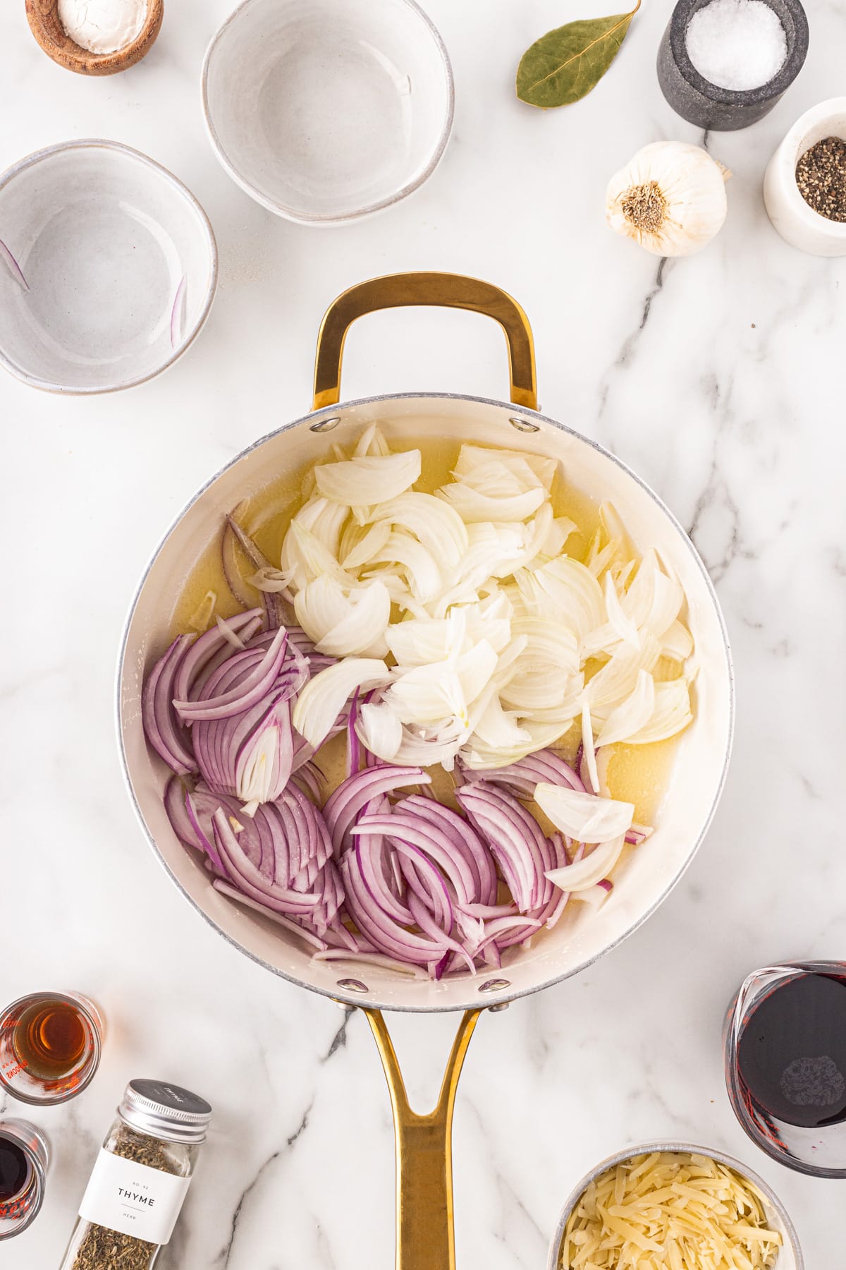 Onions added to a pan. 
