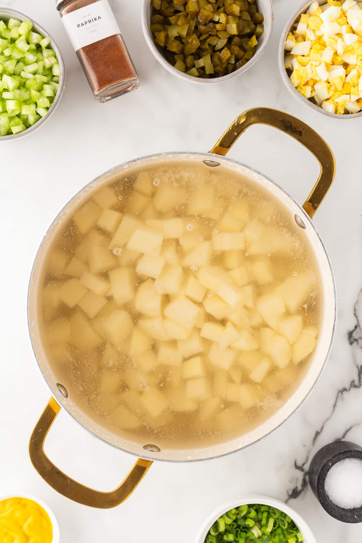Potatoes in water in a pot. 