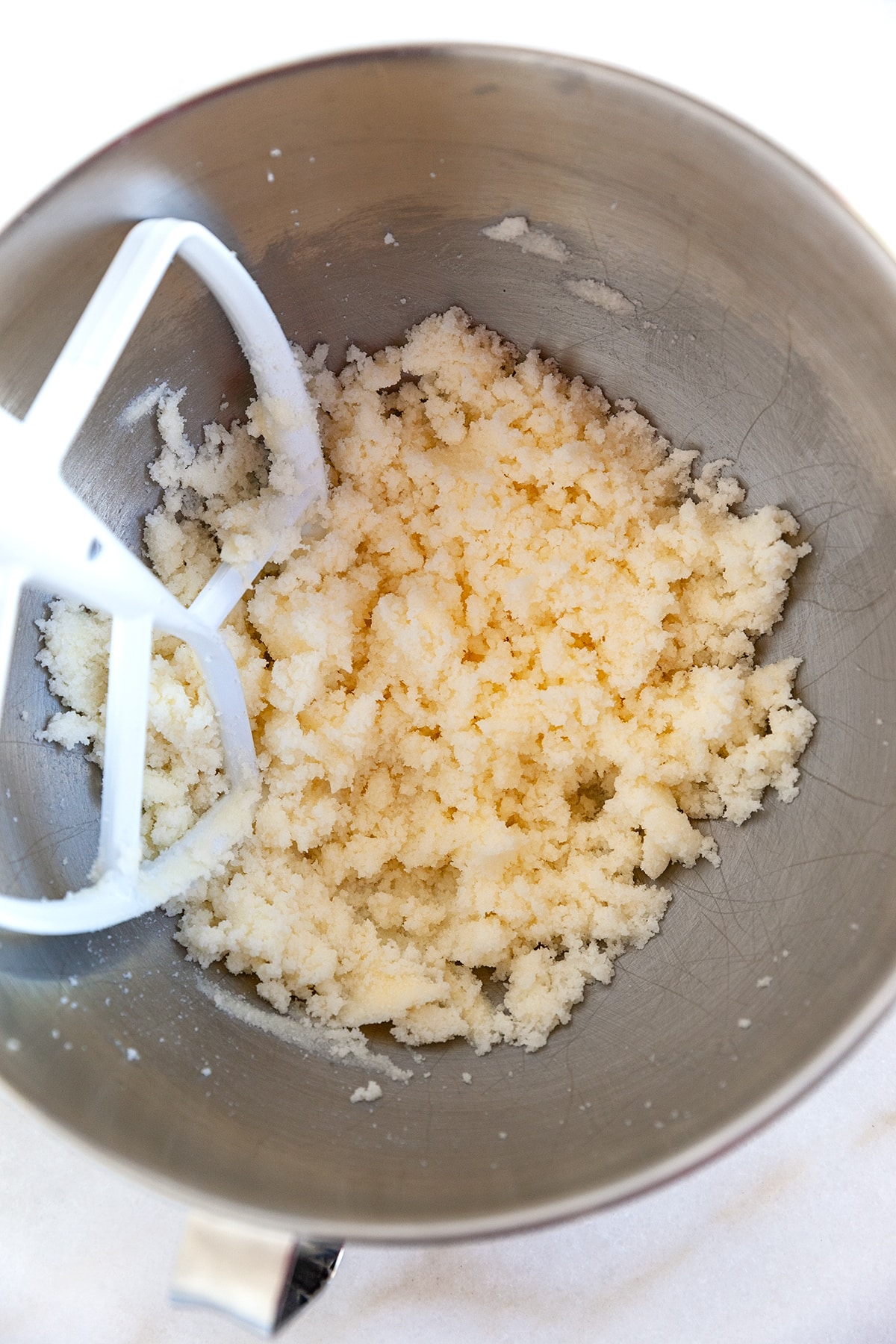 Butter and sugar creamed together in a bowl. 