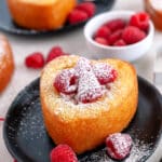 Heat shaped cakes on black plates.