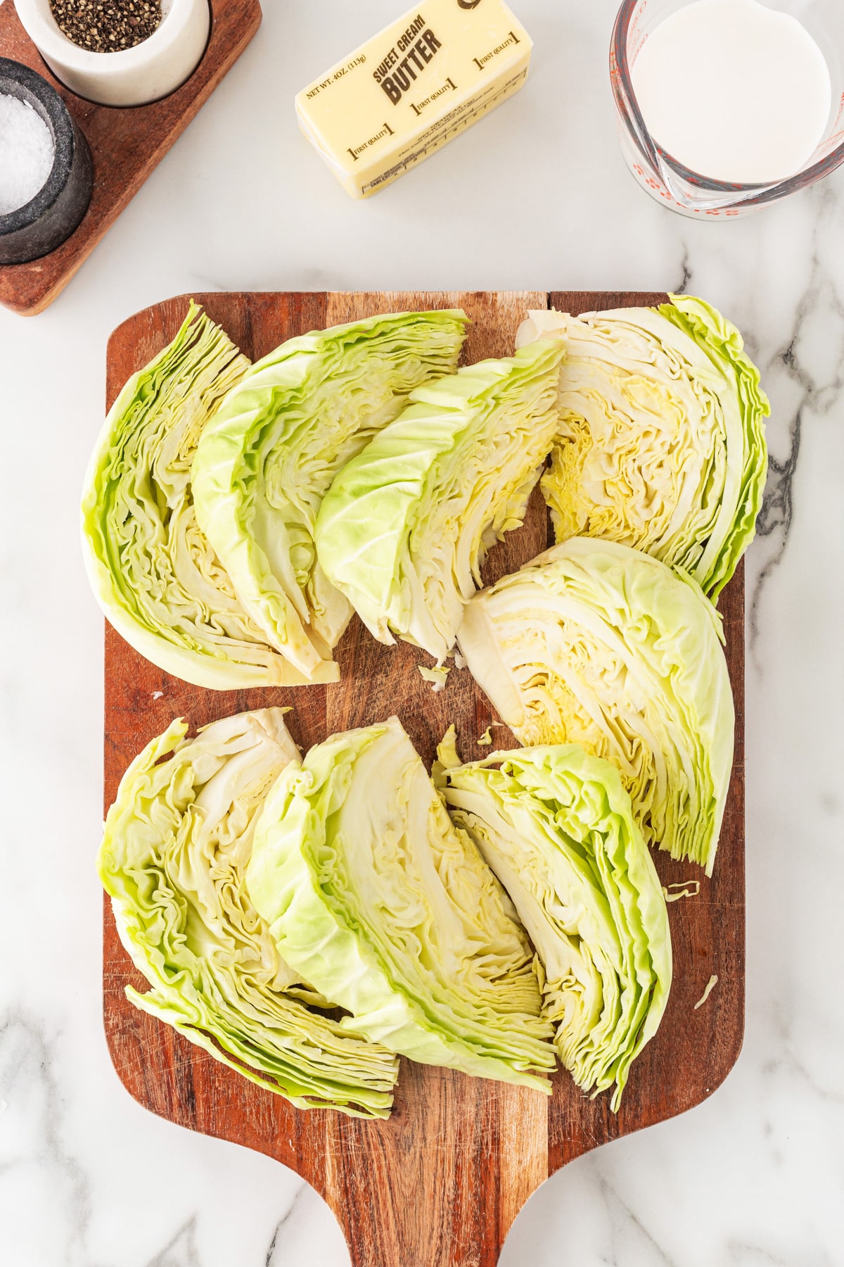 Cabbage wedges on a board. 