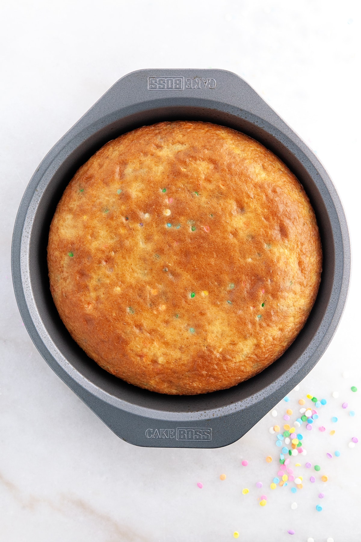 Baked cake in a round pan. 