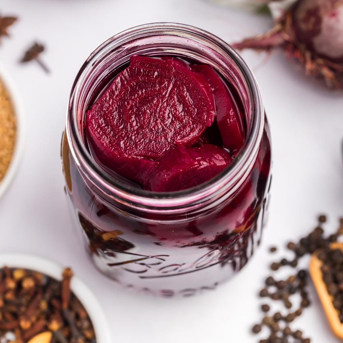 Looking into a jar of pickled beets. 