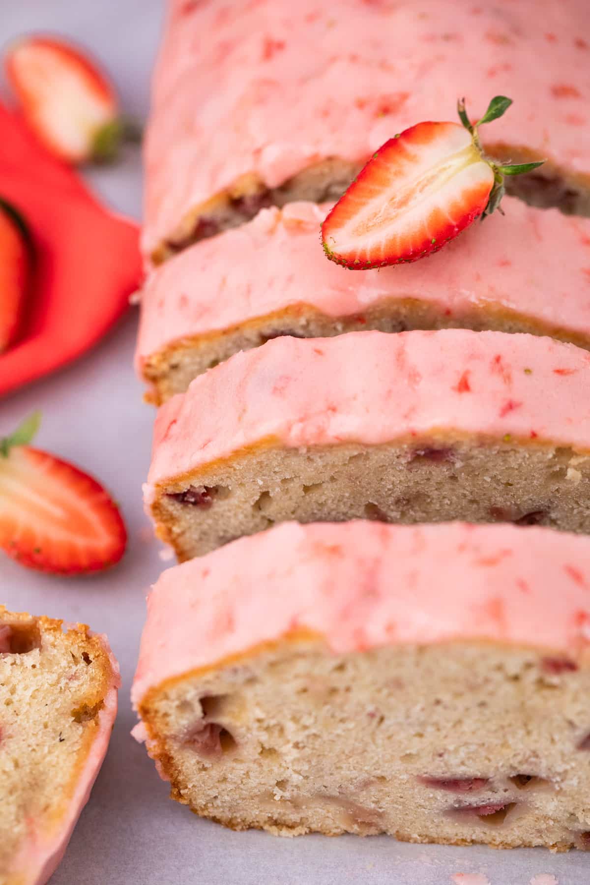 Sliced cake from overhead with half a strawberry on top. 