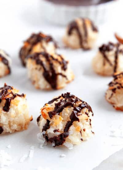 Close-up of a chocolate drizzled macaroon.