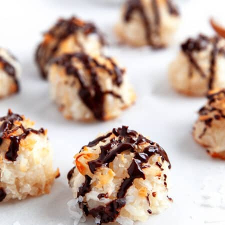 Close-up of a chocolate drizzled macaroon.
