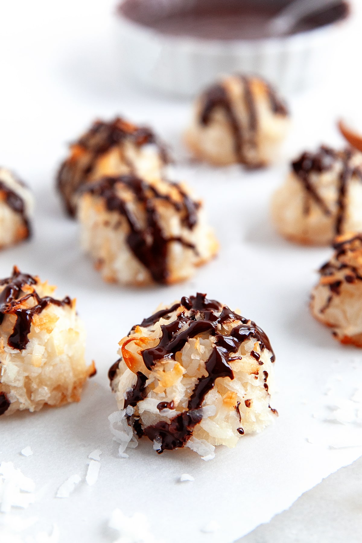 Close-up of a chocolate drizzled macaroon. 