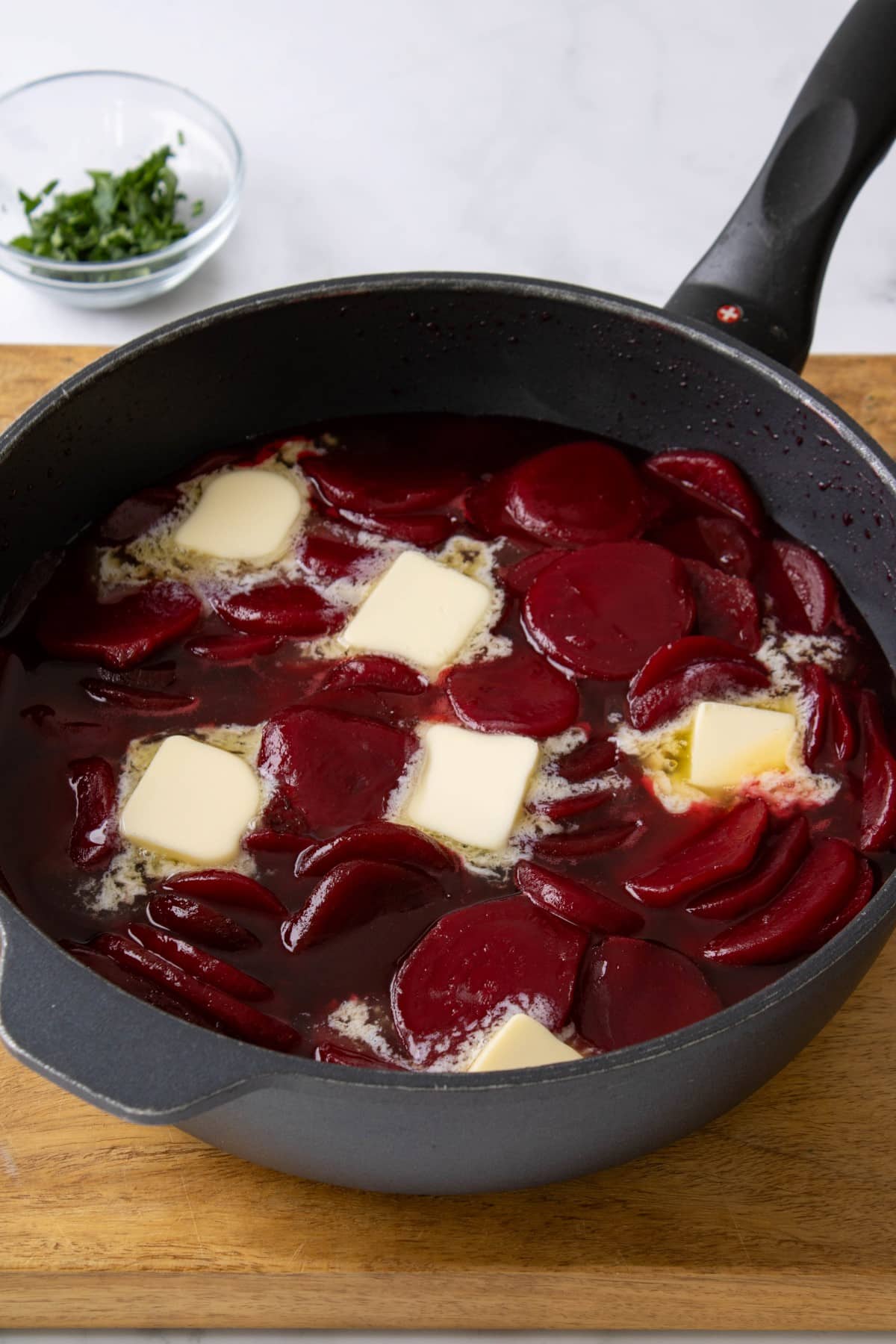 Beets with butter melting into the sauce. 