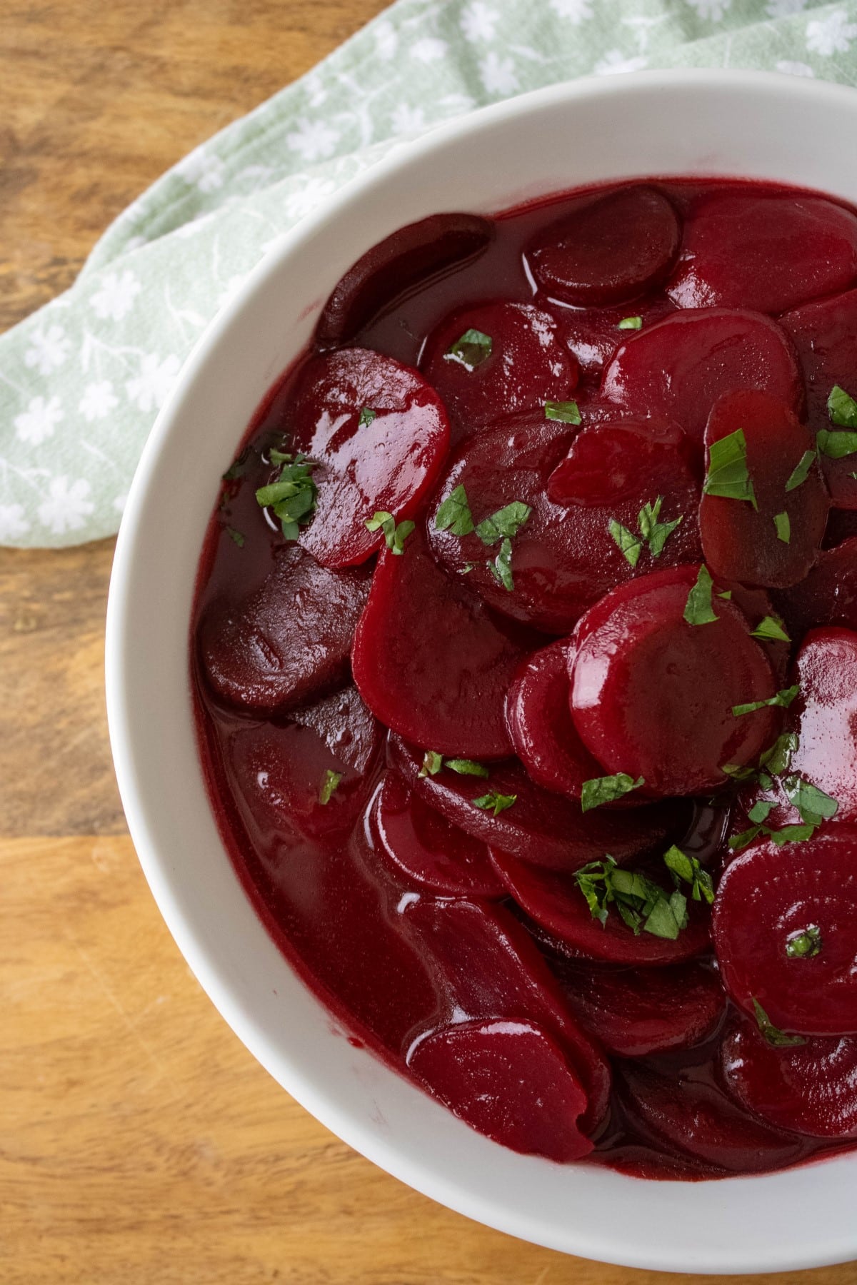 Harvard Beets in a bowl with fresh parsley on top. 