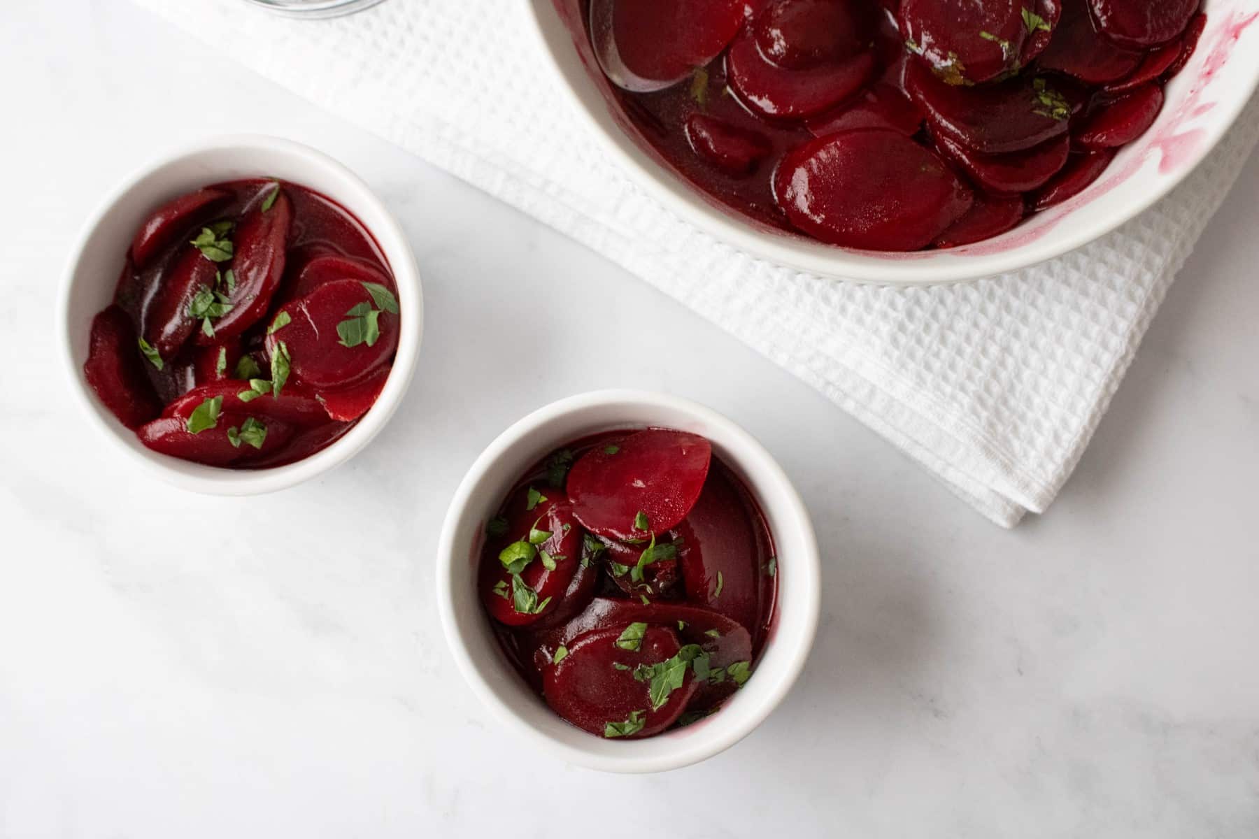Horizontal picture of small and large bowls of Harvard Beets. 