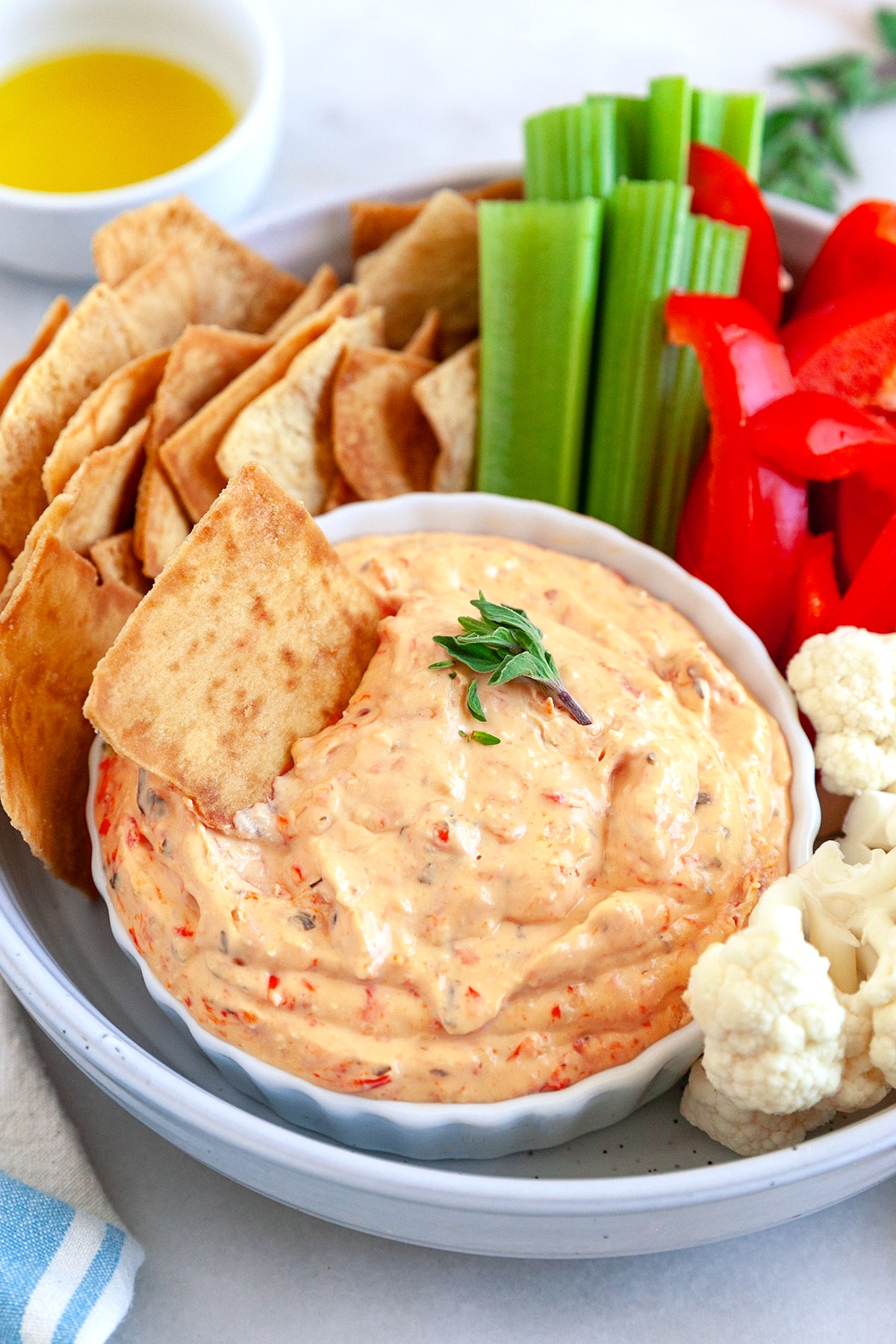 Feta Roasted Red Pepper Dip with pita chips and veggies. 
