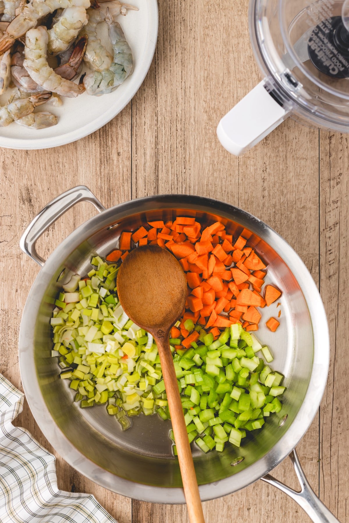 Vegetables chopped up in a pot ready to cook. 