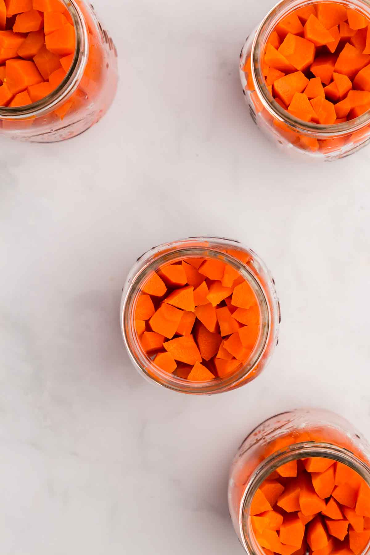 Overhead shot of carrots in a jar. 