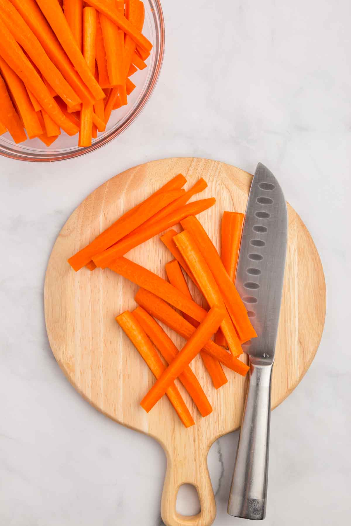 Cutting carrots into sticks. 