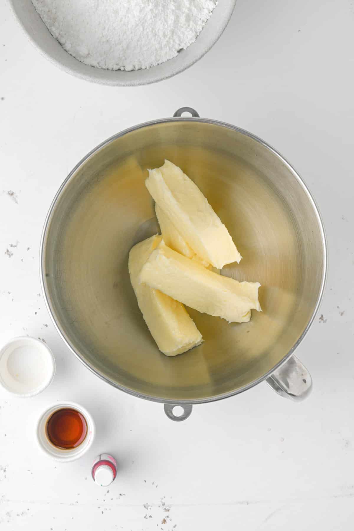 Sticks of butter in a bowl. 