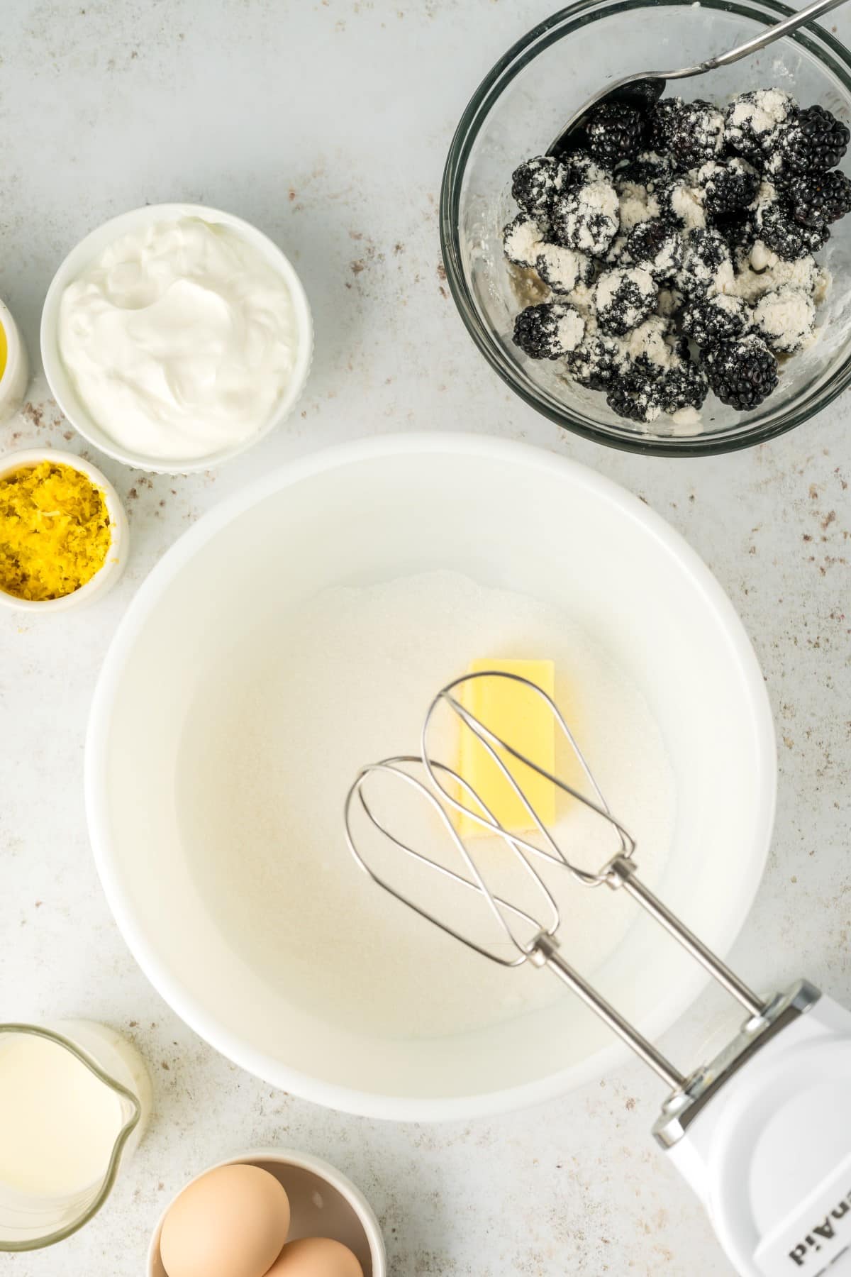 Butter and sugar in a bowl ready to be whipped. 