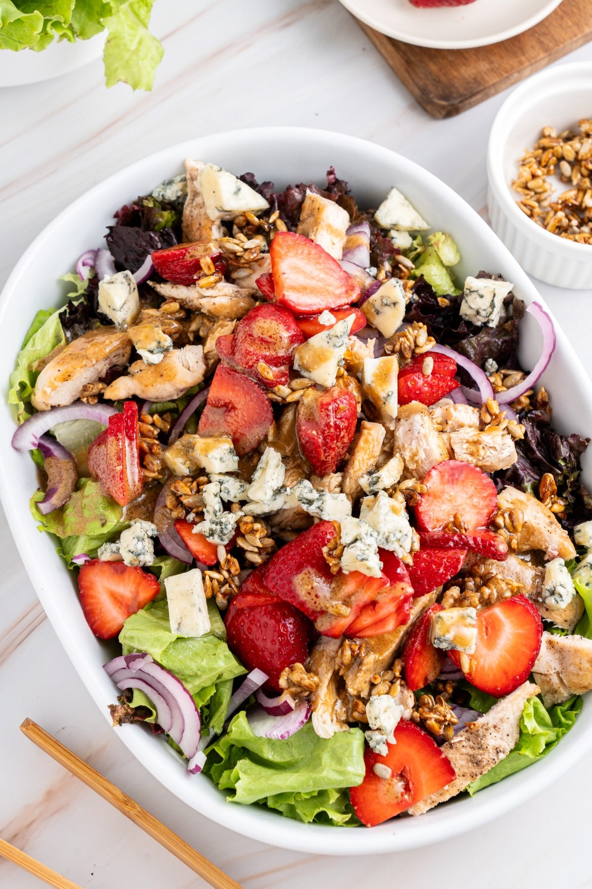 Finished salad in an oval bowl. 