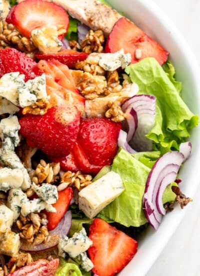 Showing a partial bowl of strawberry chicken salad.