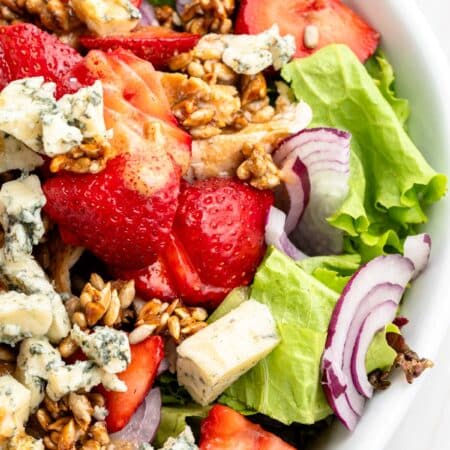 Showing a partial bowl of strawberry chicken salad.