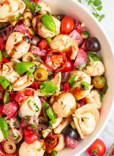 Overhead close-up of the partial bowl of Tortellini Pasta Salad.