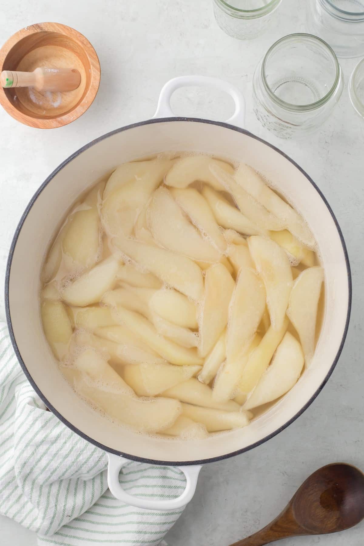 Pears in a pot of syrup. 