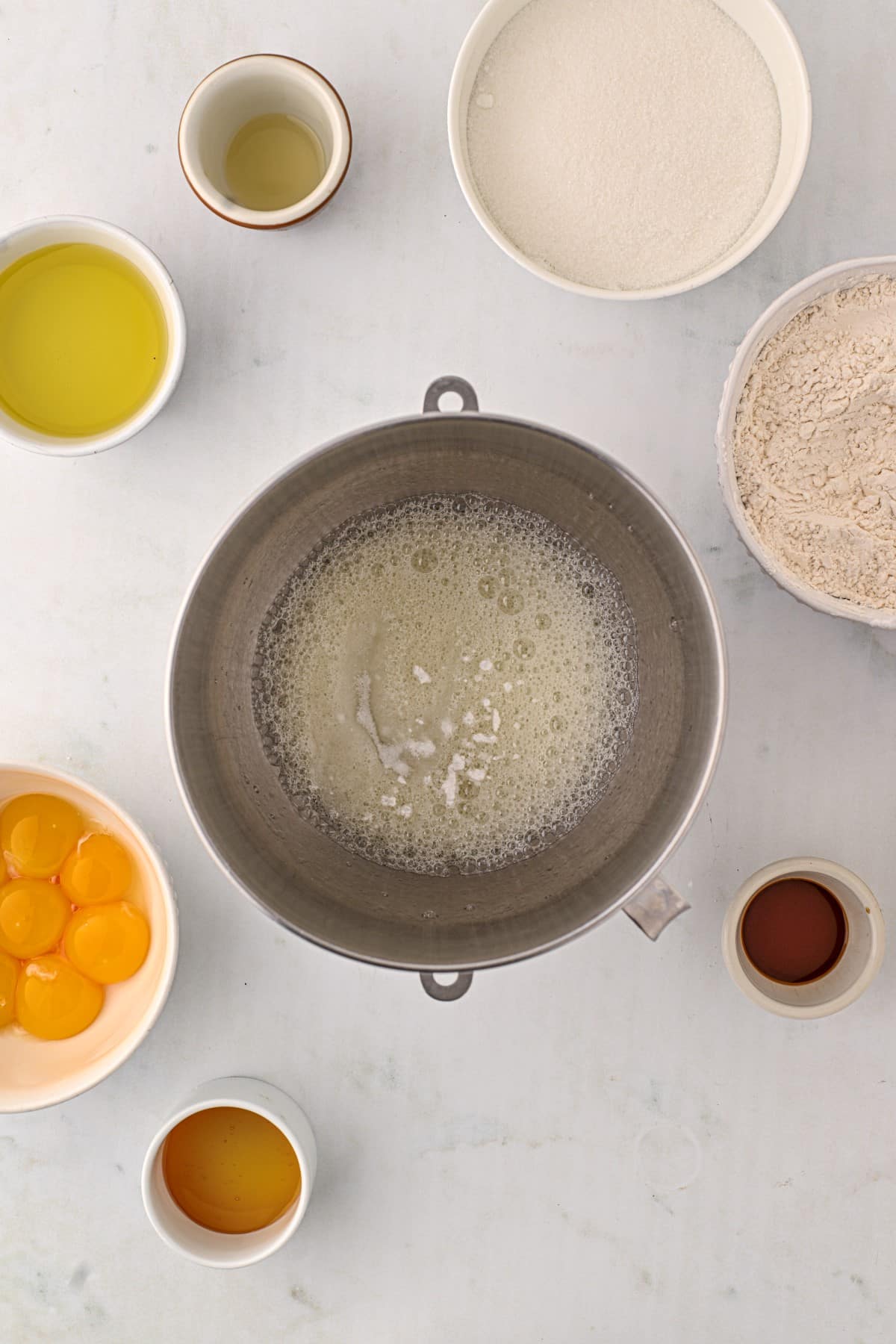 Adding cream of tartar to slightly beaten eggs. 