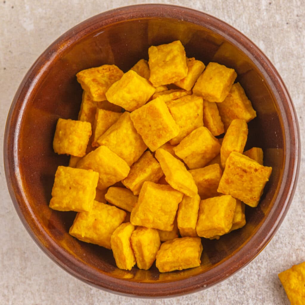 Overhead shot of cheese snacks in a bowl.