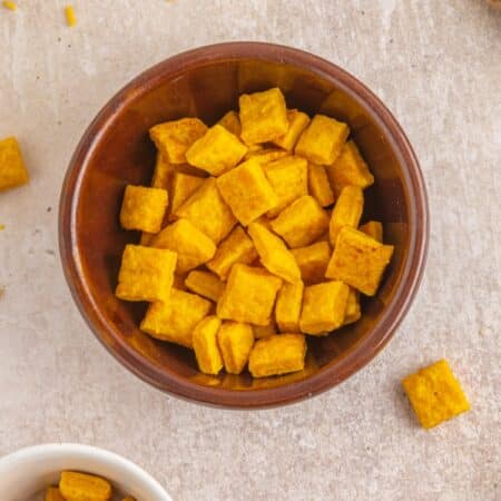 Overhead shot of Homemade Cheez Its in a bowl.