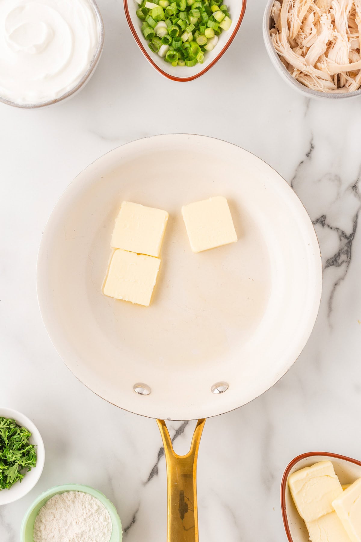 Butter added to a saute pan. 