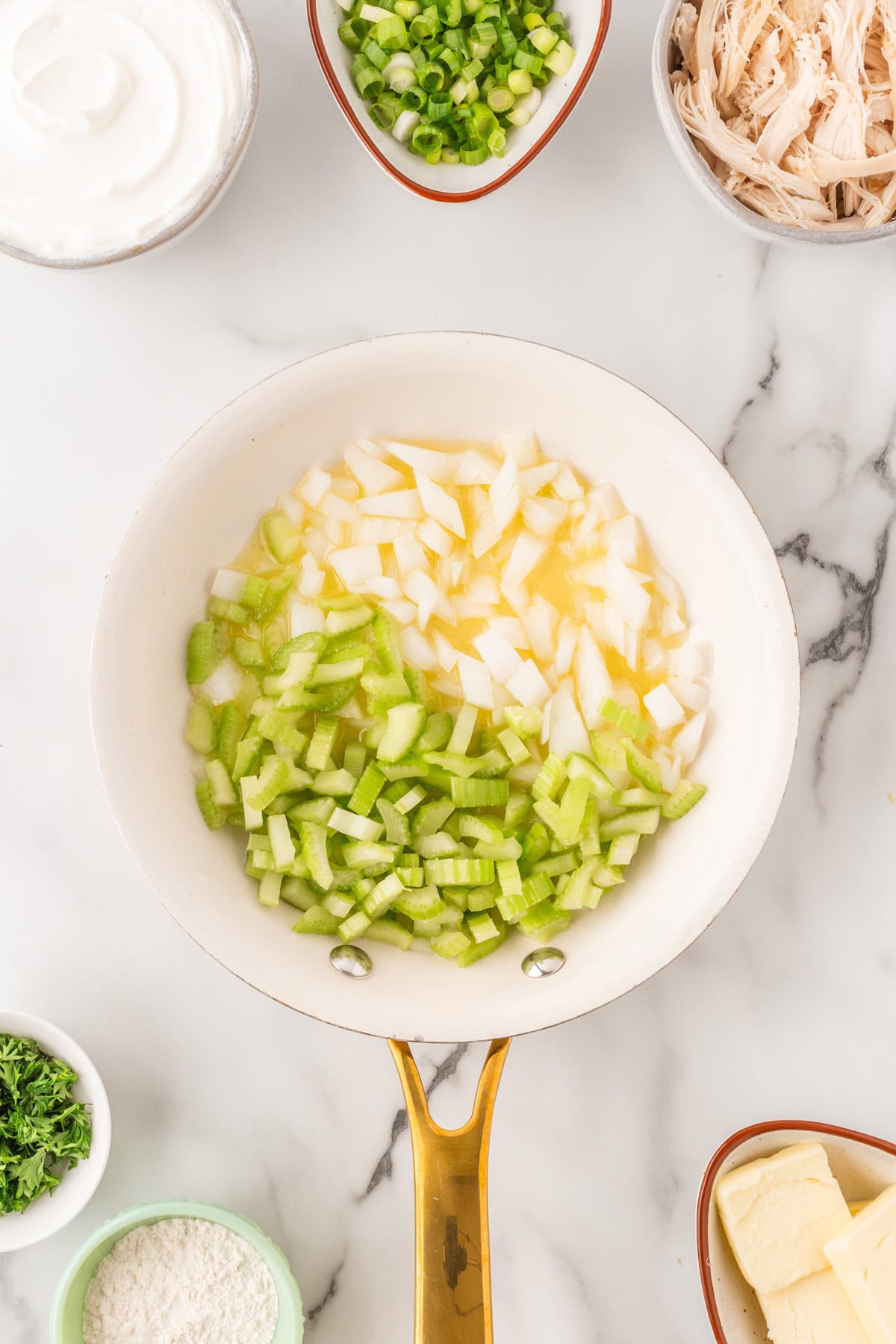 Onion and celery added to the saute pan. 