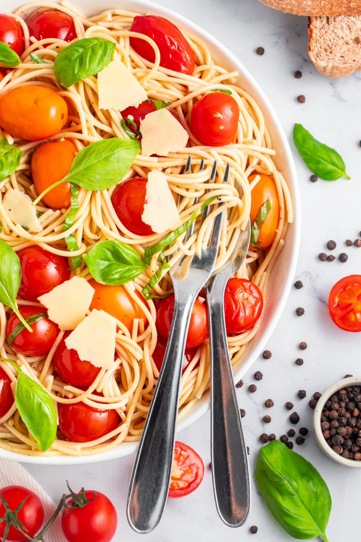 Fresh Tomato Pasta Recipe with a fork and spoon to serve. 