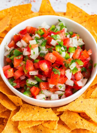 Pico de Gallo in a bowl with tortilla chips.