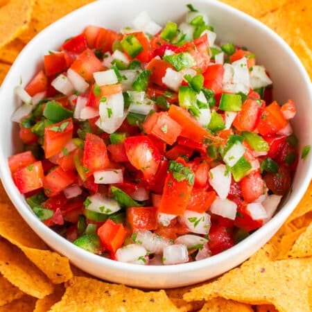 Pico de Gallo in a bowl with tortilla chips.