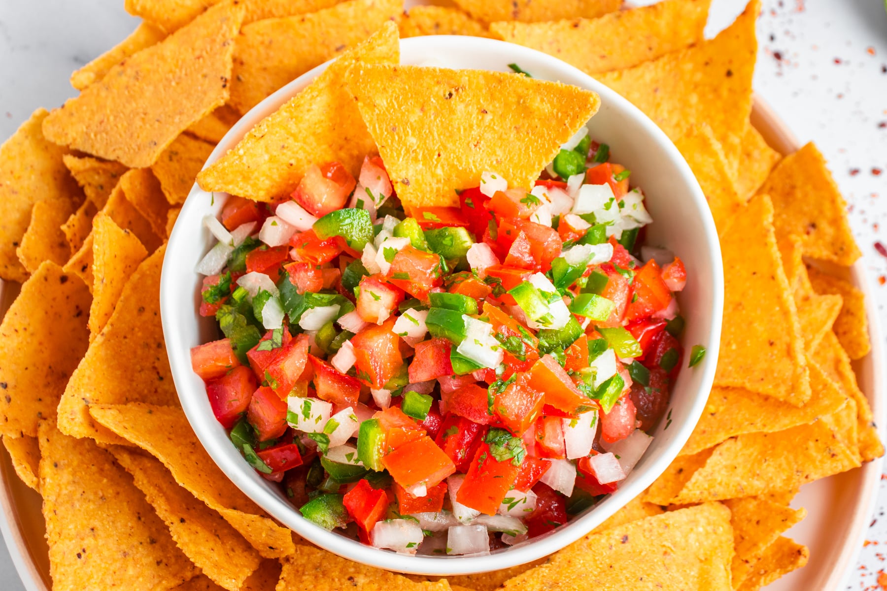 Pico de gallo served with nachos, horizontal picture. 