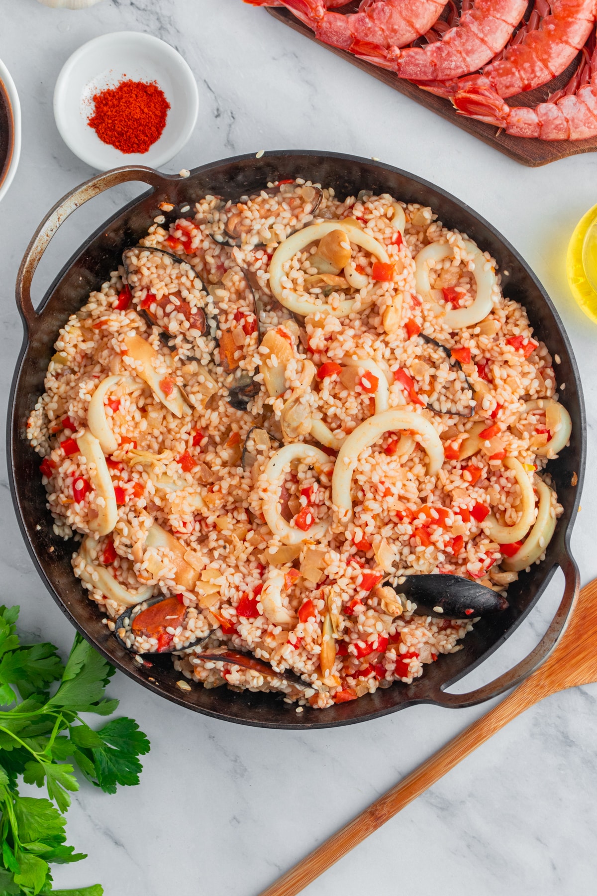 Rice mixed with seafood and vegetables for a seafood paella.