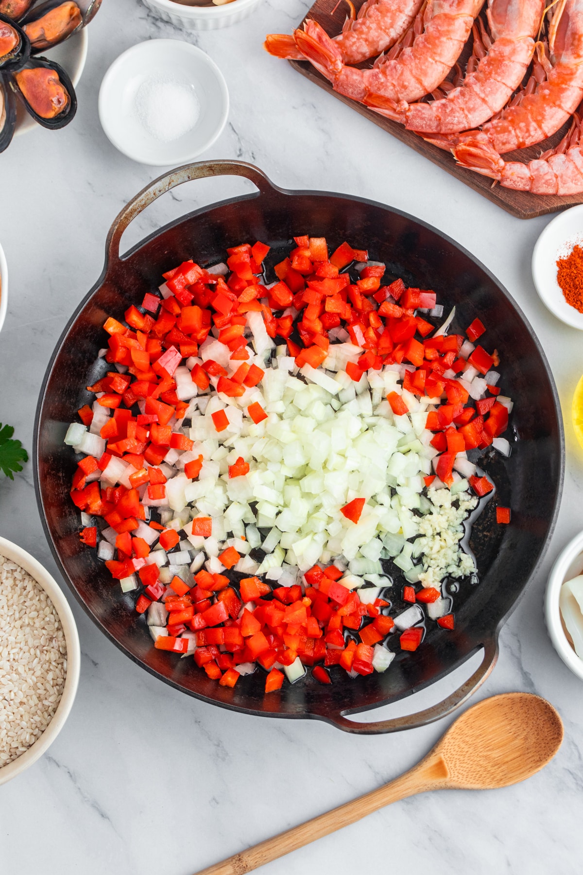 Sauteing diced onion, red bell pepper and garlic.