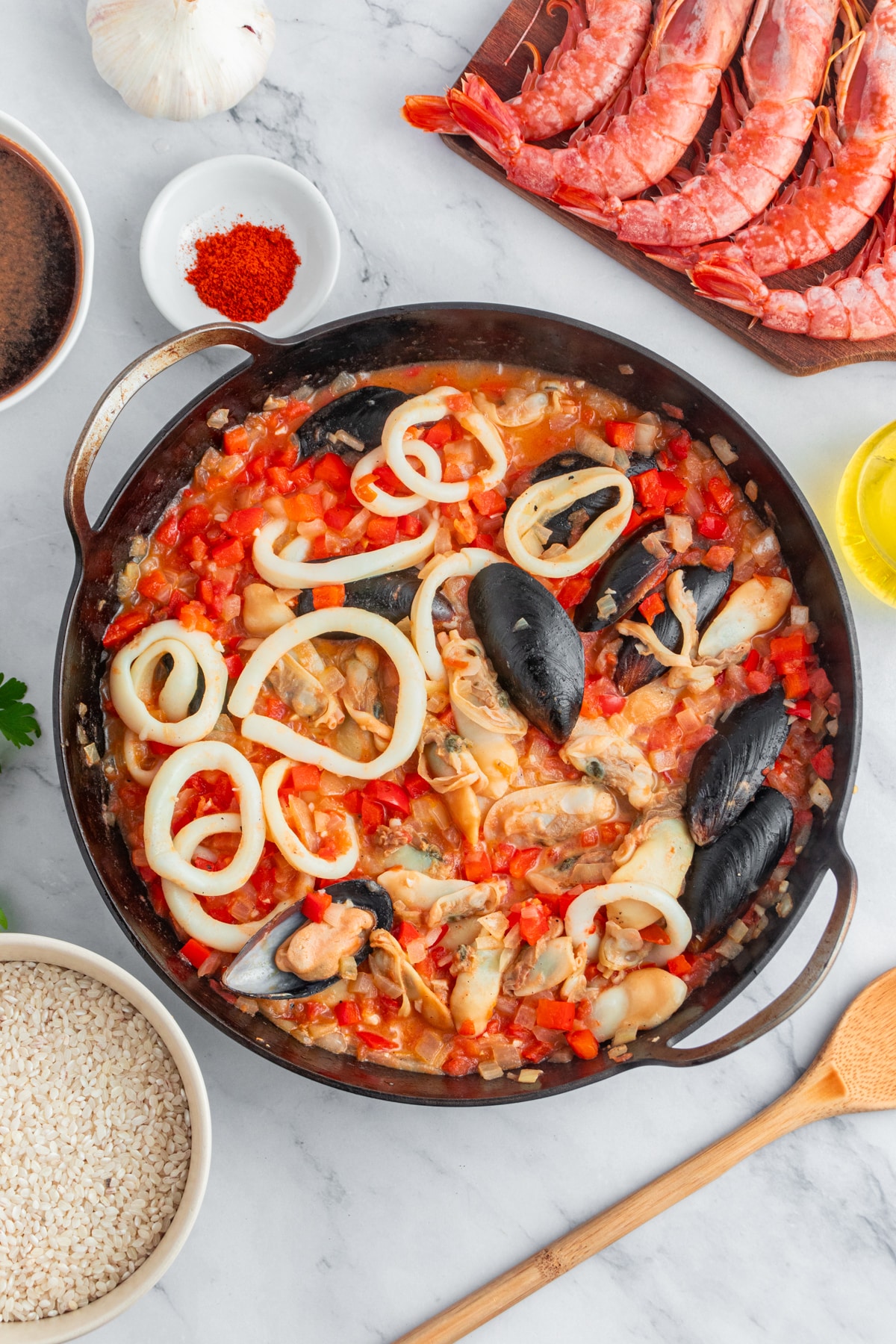 Simmering vegetables for a seafood paella.