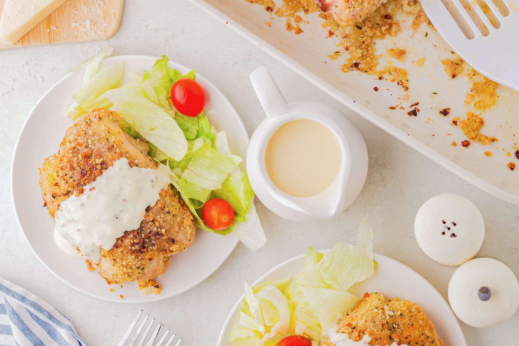 Plated with sauce and a salad. 