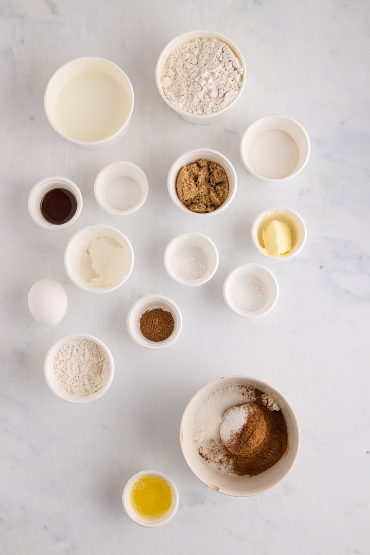 Dry ingredients in a bowl with butter in another bowl. 