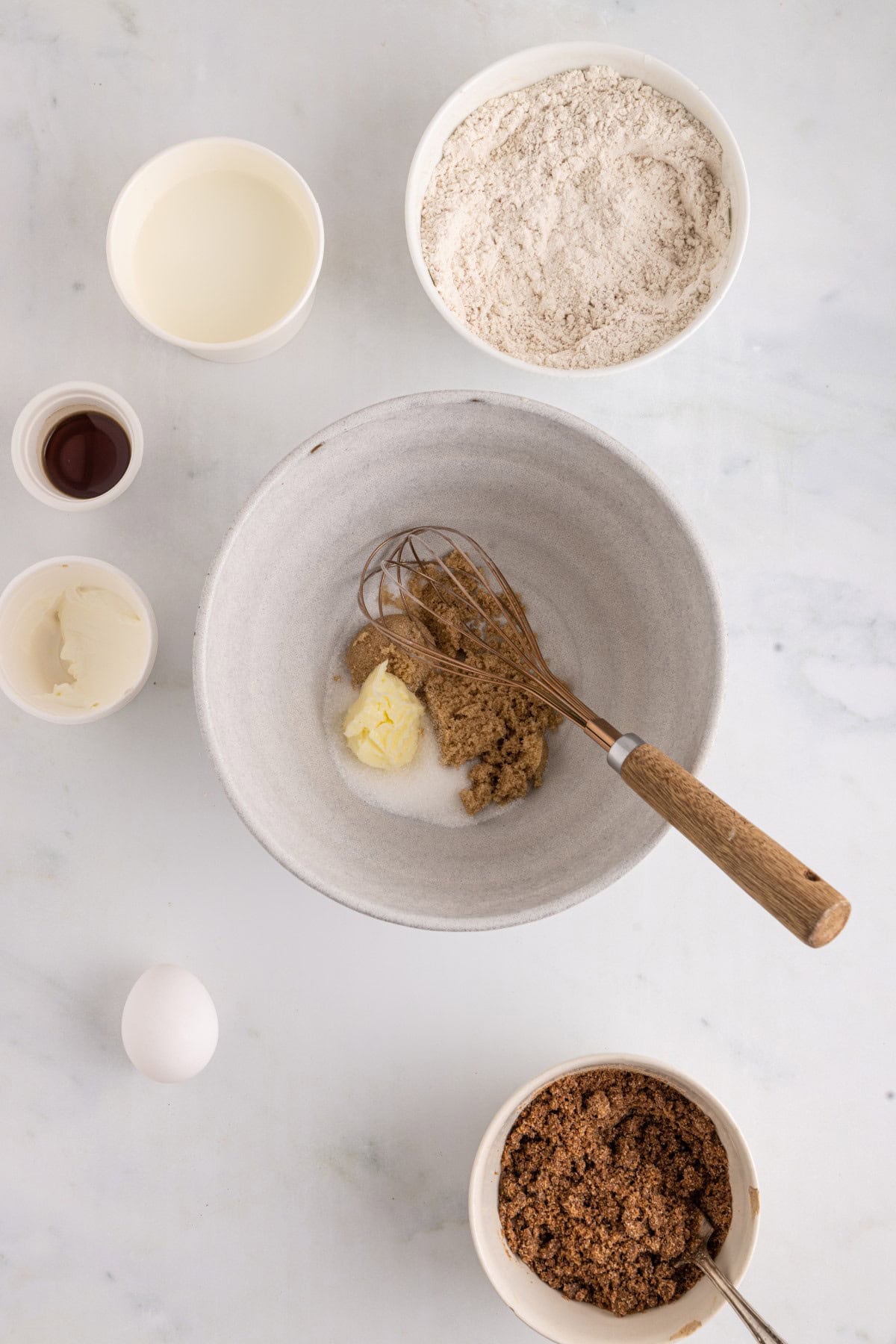 Butter and sugar added to a bowl. 