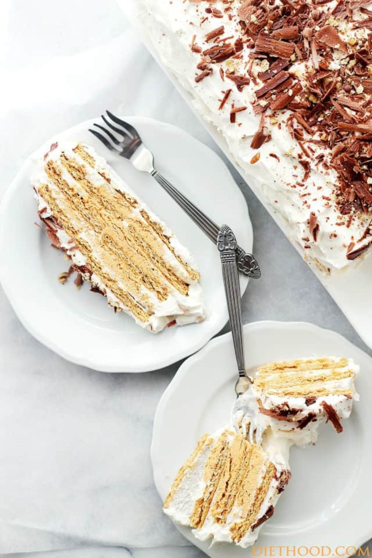 Two slices of pumpkin mousse icebox cake on small plates.