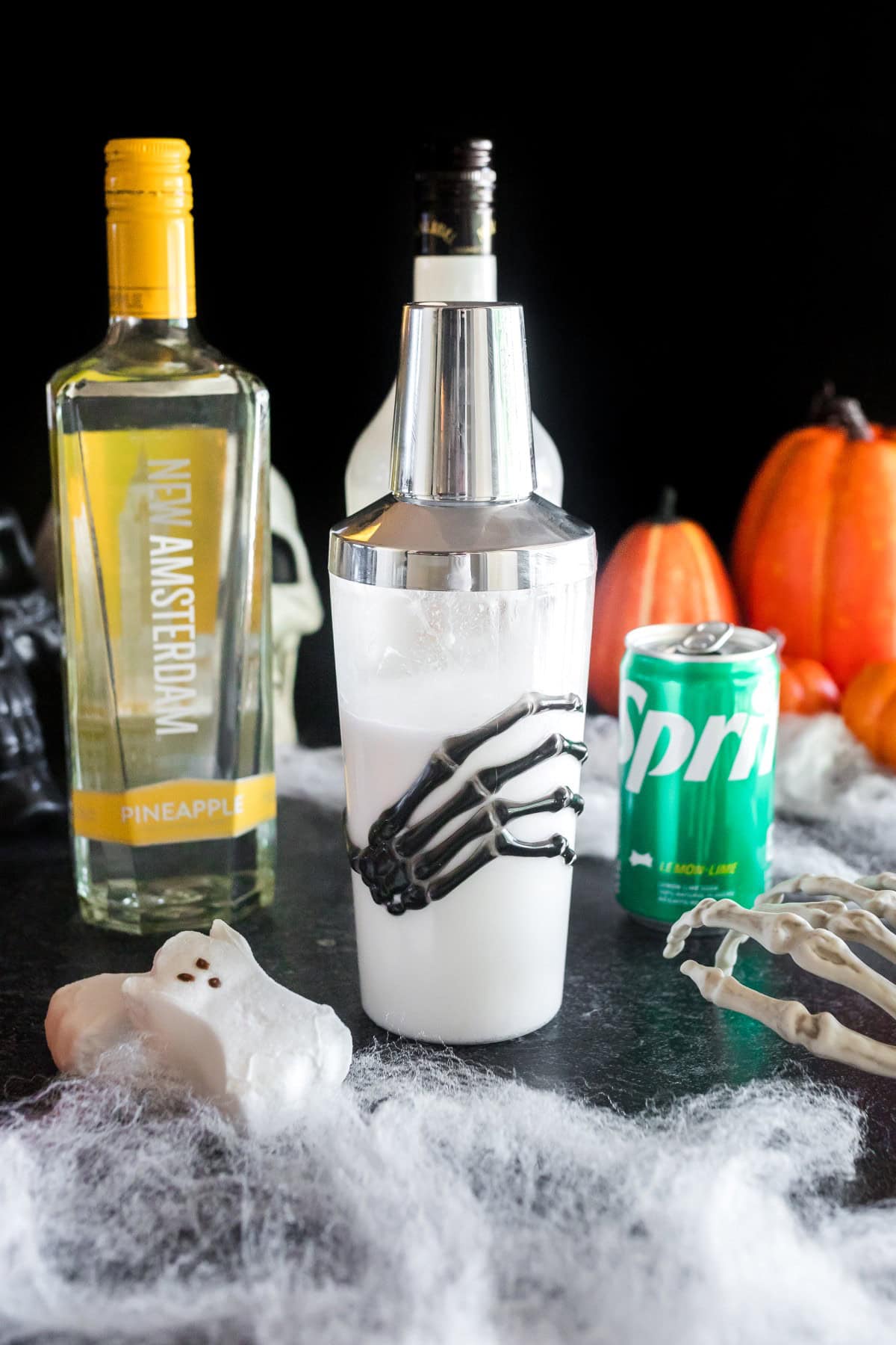 Skeleton hand cocktail shaker with the ingredients inside. 