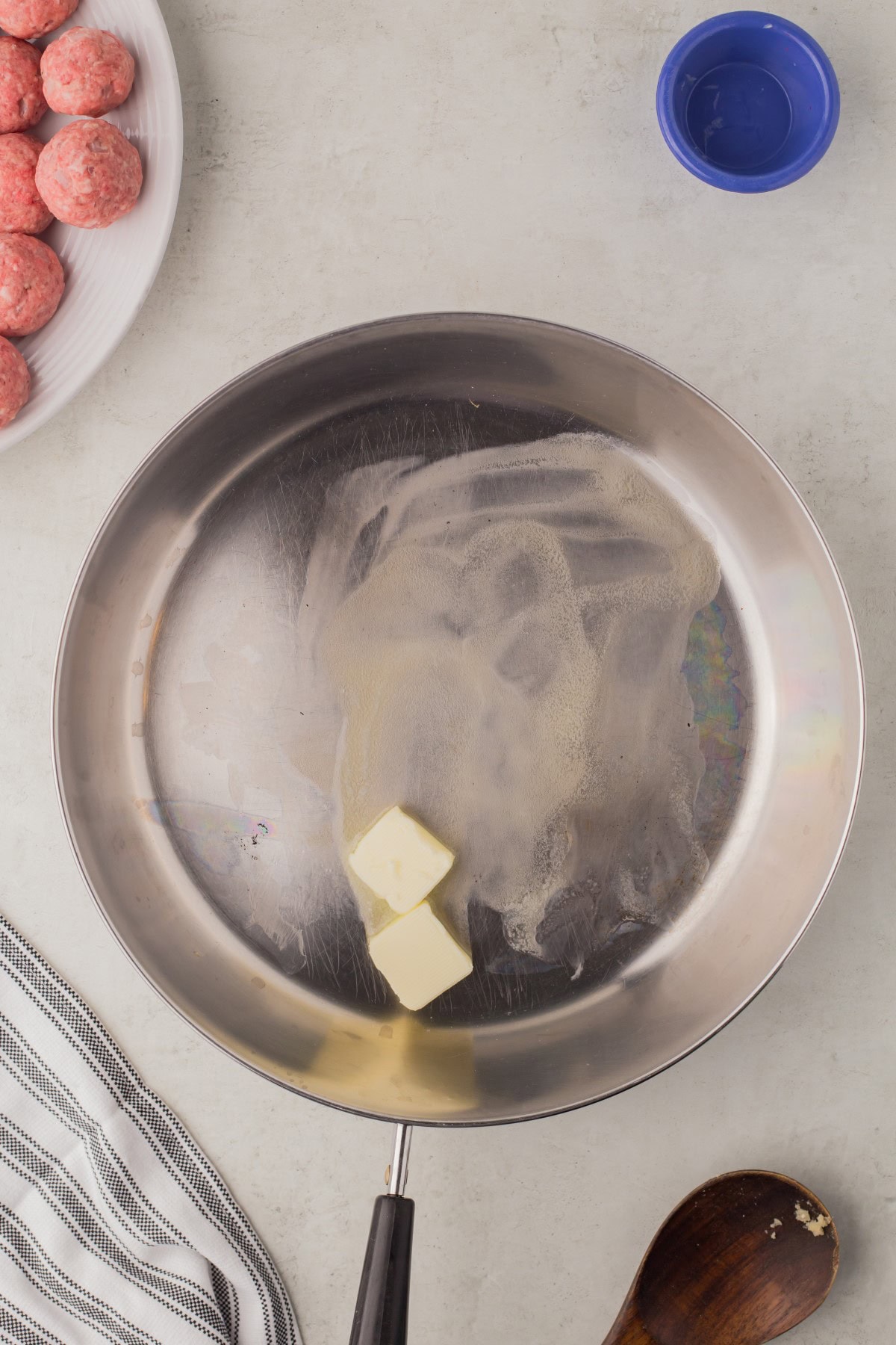 Butter added to a pan. 