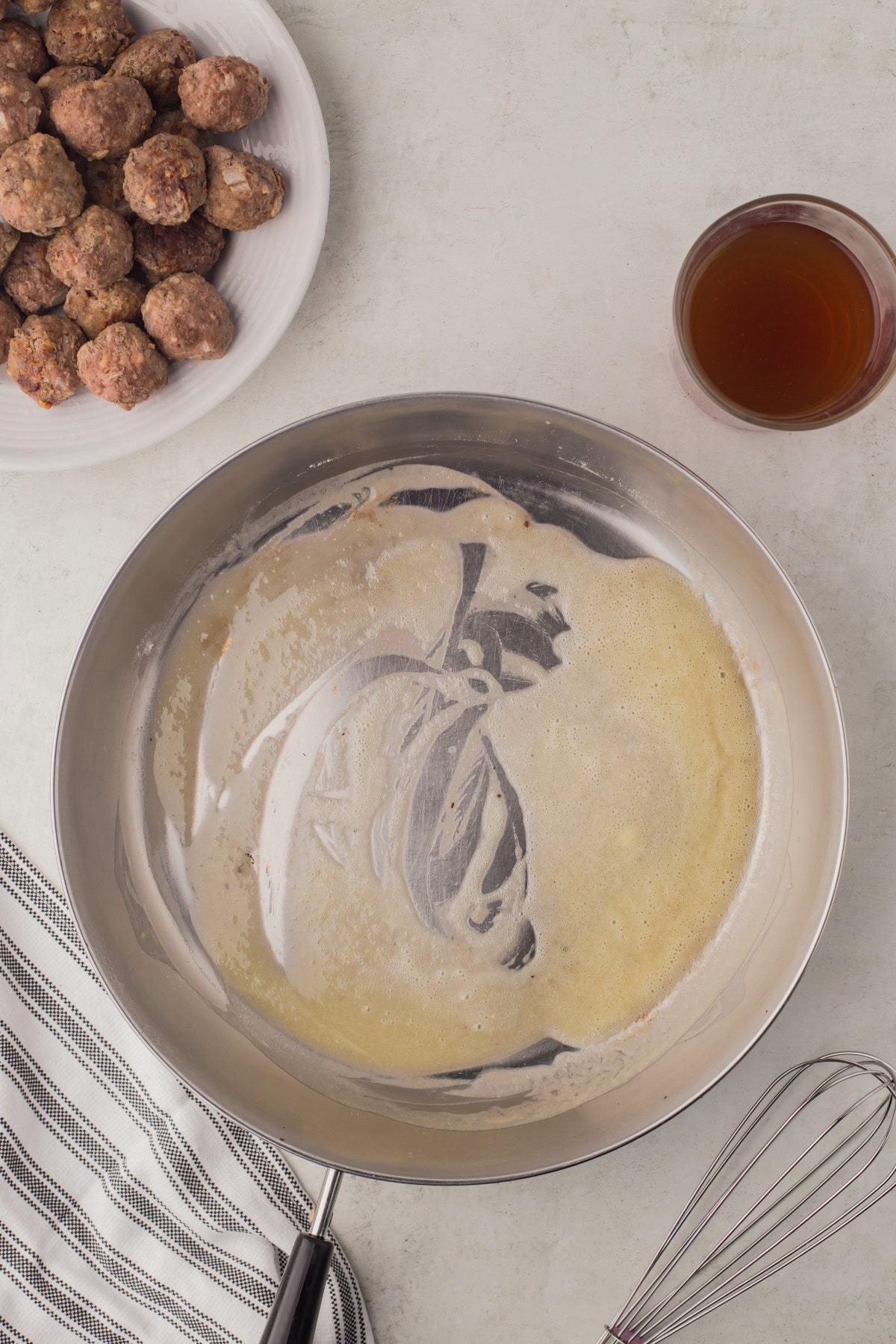 Butter added to the same pan after the meatball. 