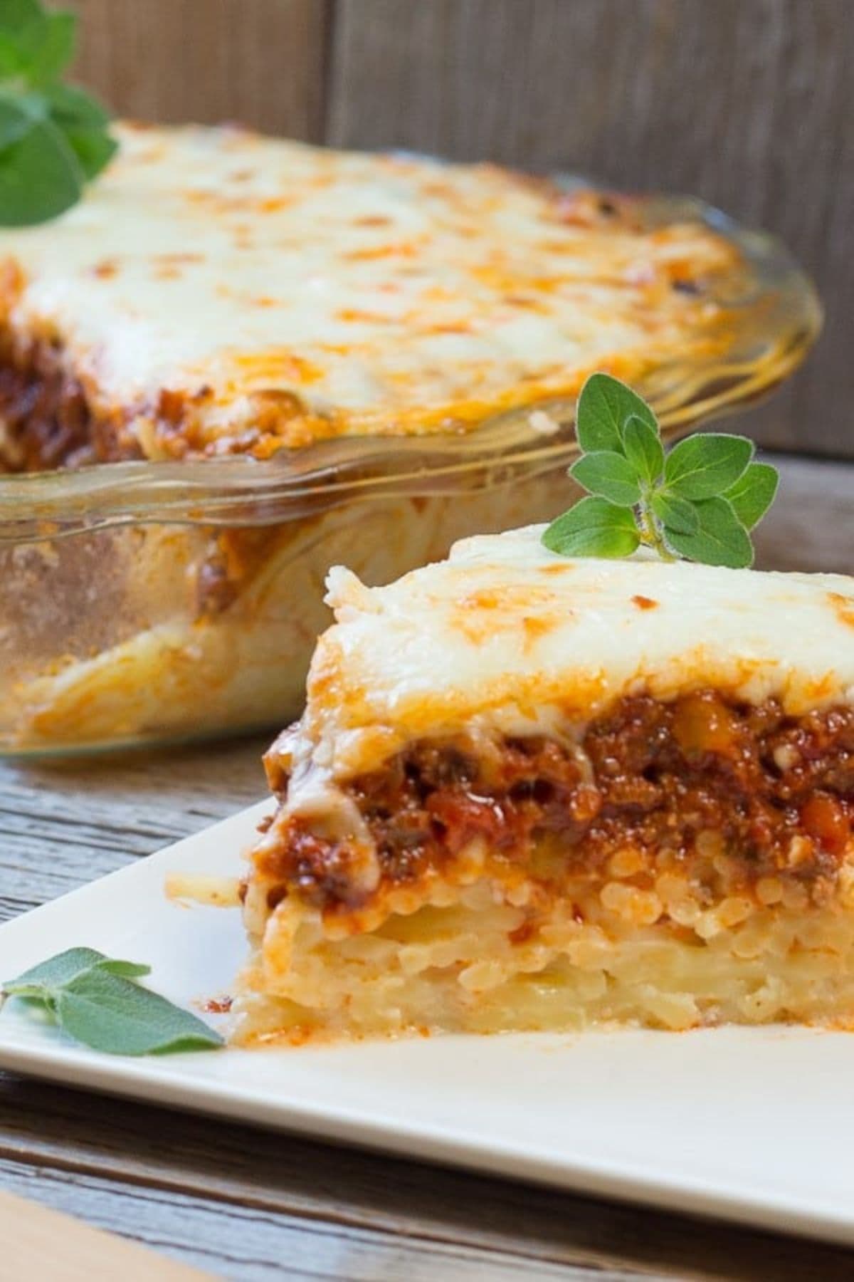 Slice of baked spaghetti pie on a small plate.