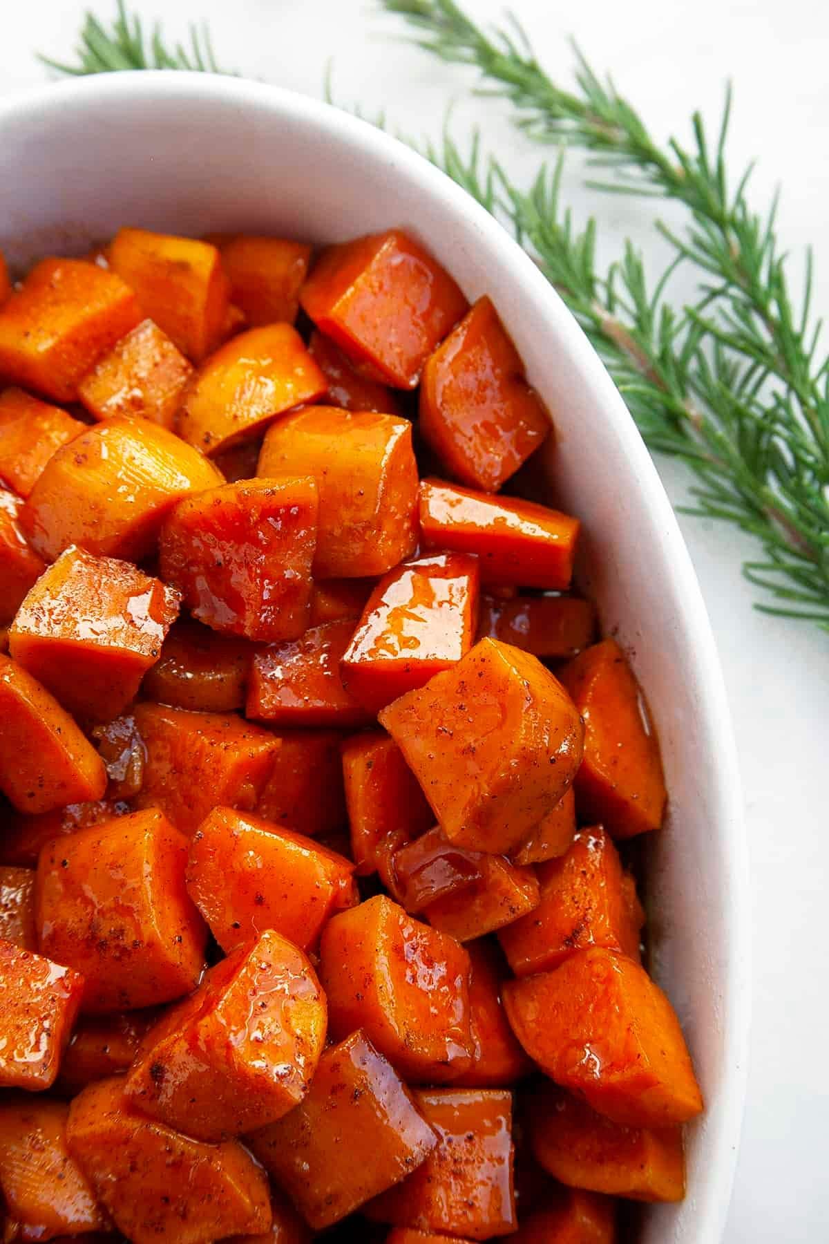 Candied sweet potatoes in a casserole dish ready to serve.