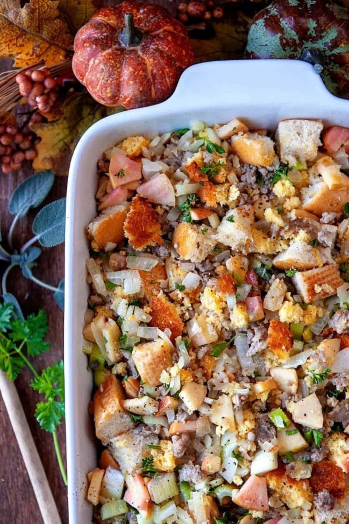 Casserole dish full of old fashioned stuffing on a table.