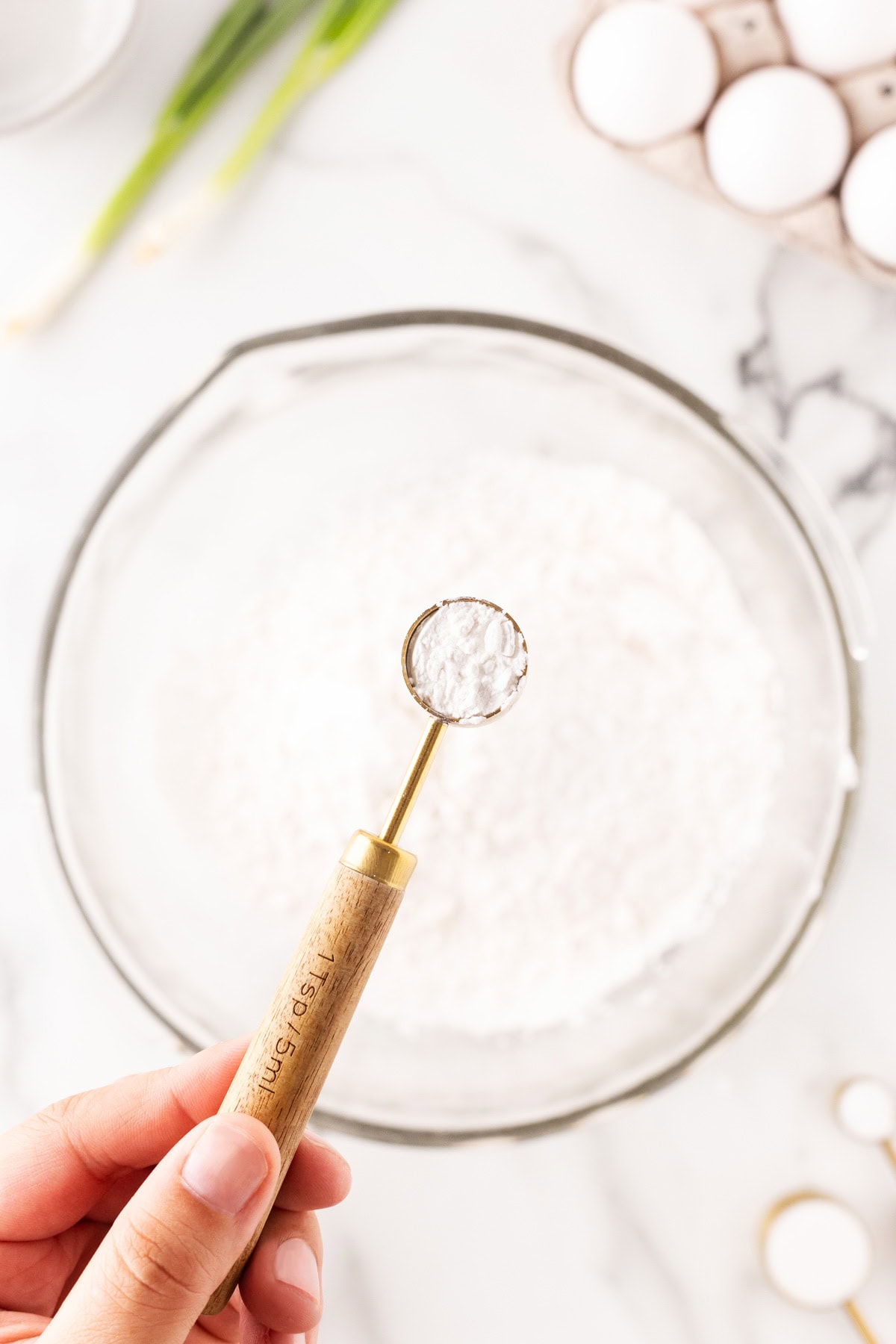 Adding baking powder. 